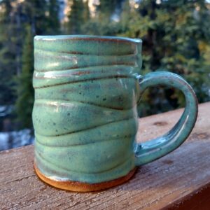 Green mug made in workshop